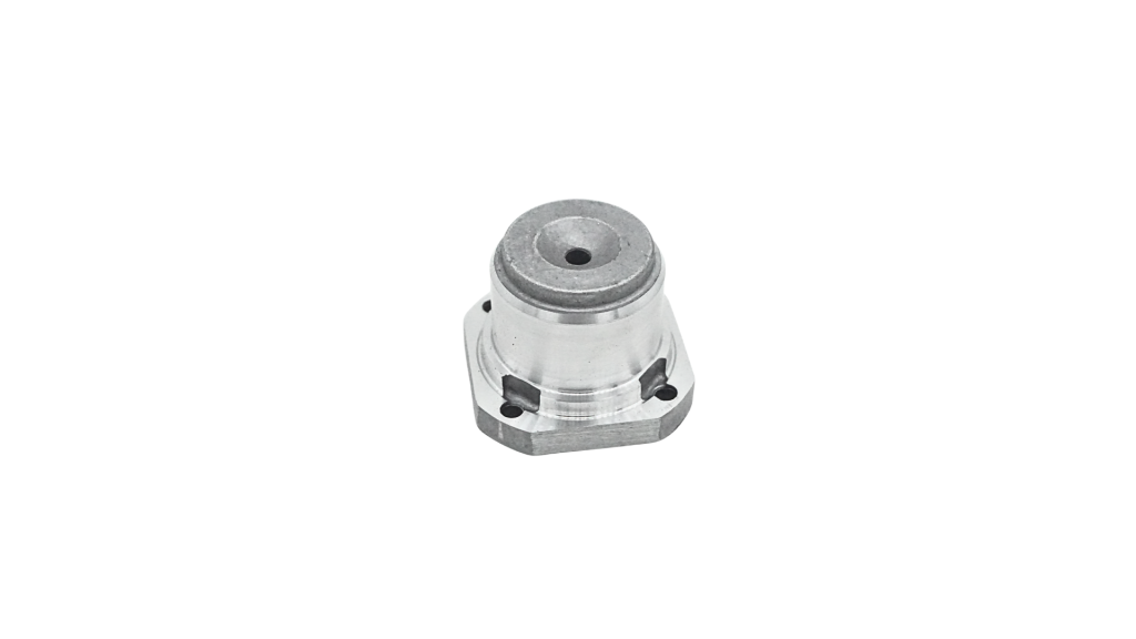 Machined aluminium compressor valve housing with hexagonal flange and centre port